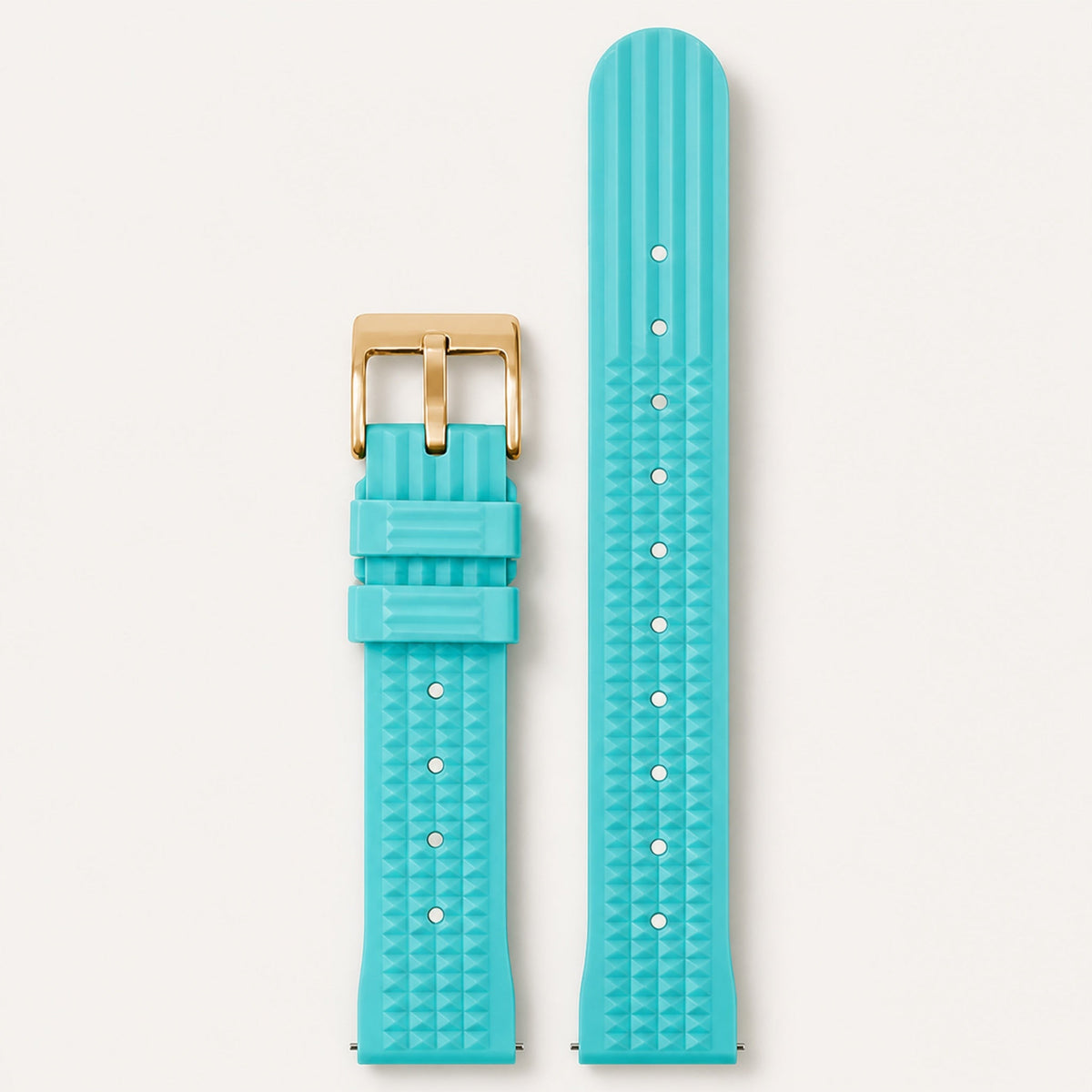 Bracelet caoutchouc gaufré — bleu clair, motif gaufré et boucle ardillon dorée — Maison Noirmont